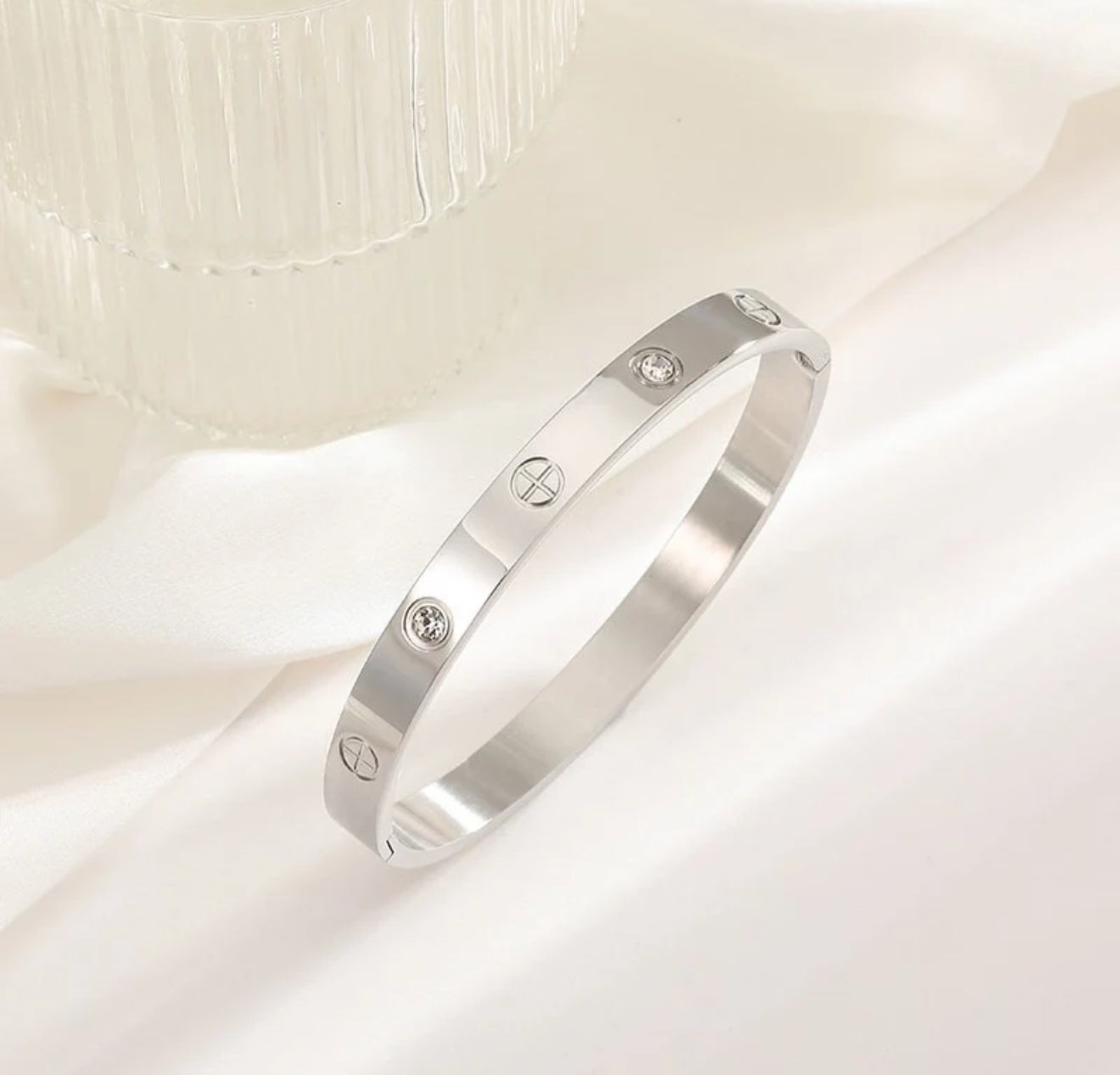 Cartier bangle with Plus sign