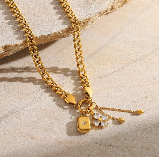 Four leaf clover and sun necklace